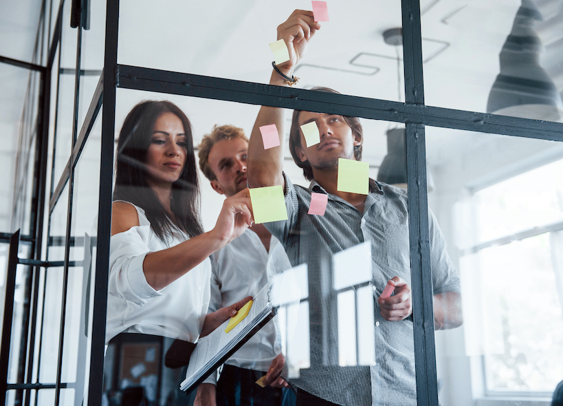 Puts,Stickers,On,The,Glass.,Young,Business,People,In,Formal - White Space | Digital Marketing Agency